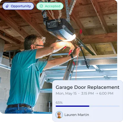 A technician installing a garage door opener