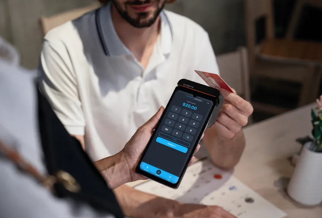 A customer paying on the Stackably Smart Terminal